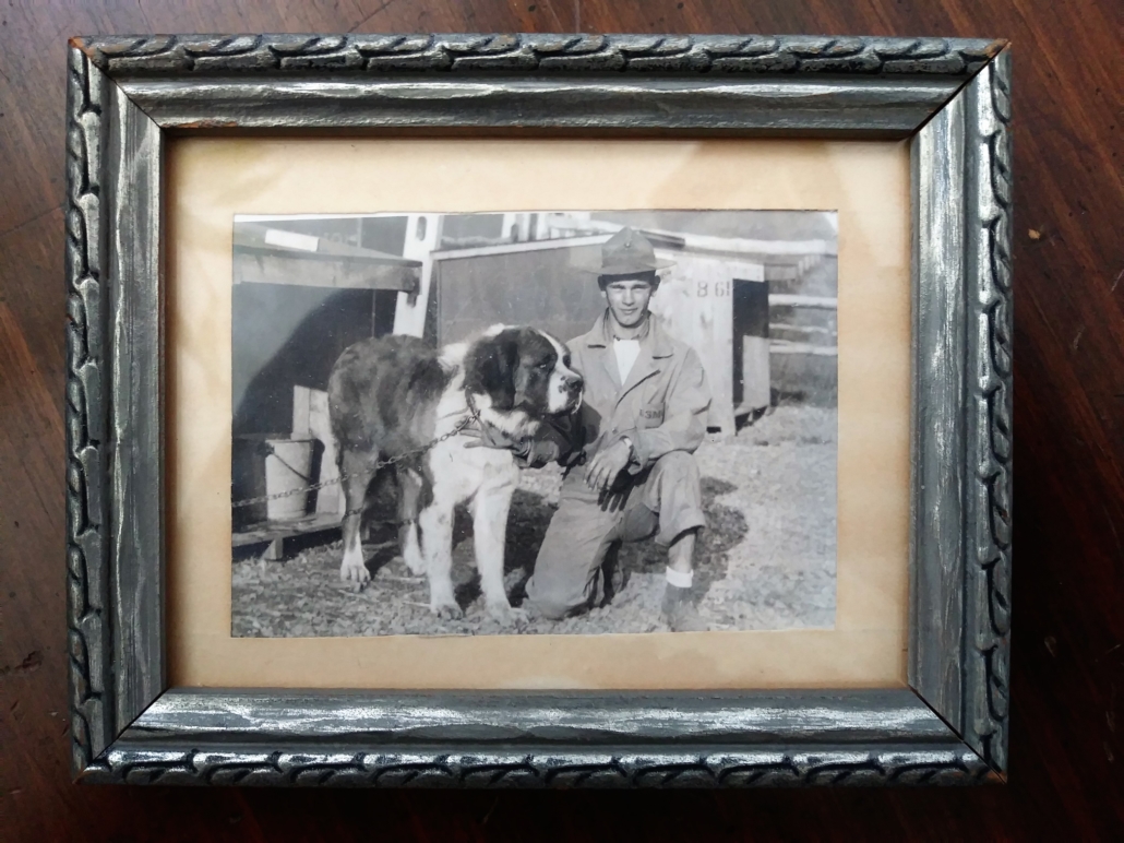 This framed photo shows Homer Finley at Front Royal, Virginia with an unnamed Saint Bernard.