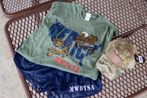 This photo shows the t-shirt, athletic shorts, and baseball cap included in every Q2-2018 care package.