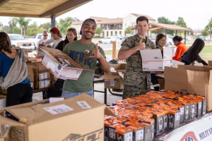 Photo of volunteers packing boxes.