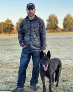 This photo shows Rick Hogg, a U.S. Army Special Ops veteran, with retired military working dog Duco. MWDTSA's 2023 toy drive is in honor of RMWD Duco.