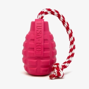 This image shows the pink USA-K9 grenade reward toy. It's pink rubber with a red and white rope. And it the toy MWDTSA is collecting during the 2023 Duco Toy Drive.