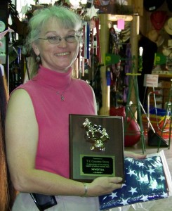 Sabine with plaque and flag