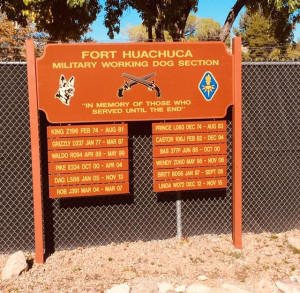 This photo shows a Fort Huachuca kennel sign that lists military working dogs who have crossed the rainbow bridge.