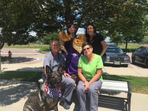 This photo shows the Align Orthodontics staff, including Dr. Colletti, along with wooden moose mascot Justin Timbertooth and guest RMWD Falco.