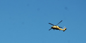 Photo shows helicopter training in the clear blue skies above Naval Station Mayport.