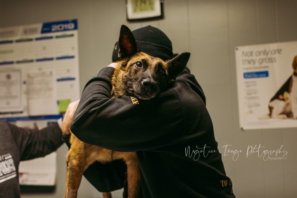 This heart-wrenching image shows Mark Daniels giving RMWD Aura a final embrace.