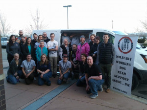 Twenty-four Q1-2018 packing volunteers pose by mail truck.