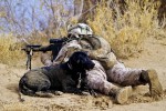 US Marine Corps Cpl. Brandon Mann with automatic scope and canine partner Ty.
